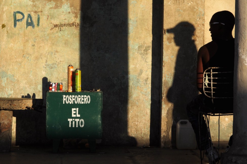 A lighter repairman waits for customers in Havana