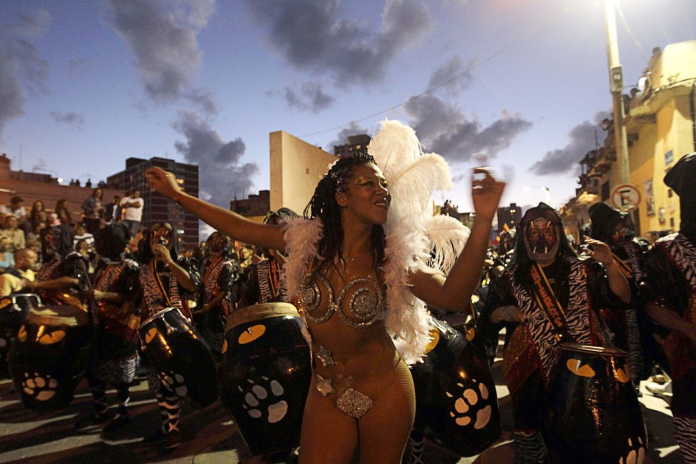 A comparsa, an Uruguayan carnival band, plays the drums to perform candombe music during the first night of the Llamadas parade in Montevideo