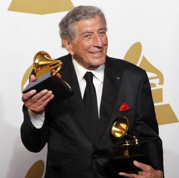 Singer Tony Bennett holds his Grammy awards backstage in Los Angeles