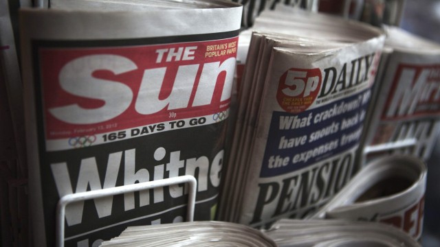 Copies of The Sun newspaper are displayed at a kiosk in London
