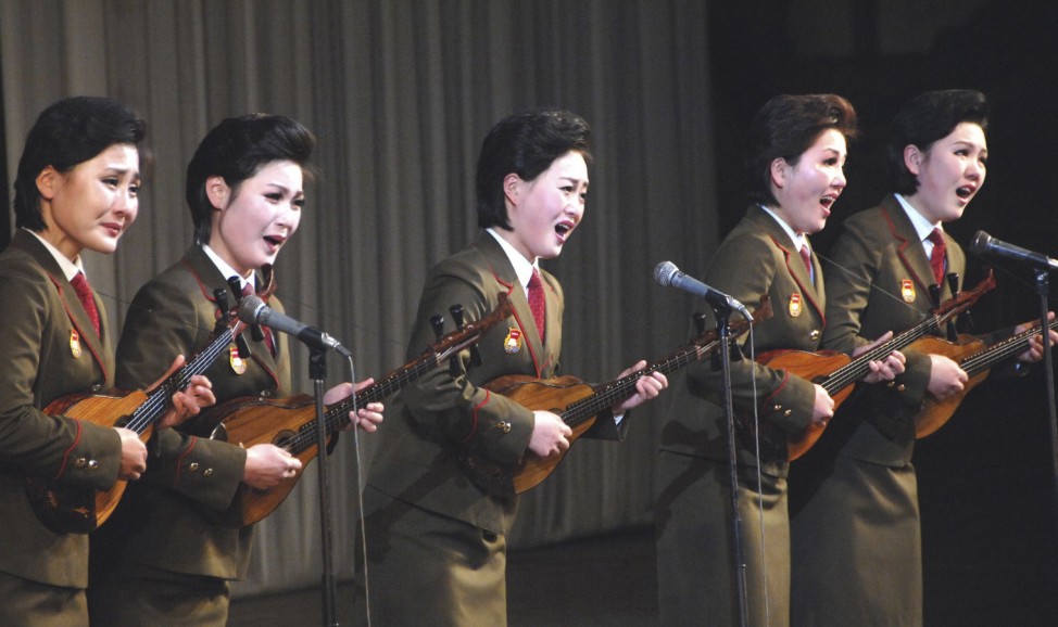 Members of the art squad of the Central Committee of the Kim Il Sung Socialist Youth League perform at the Central Youth Hall in Pyongyang