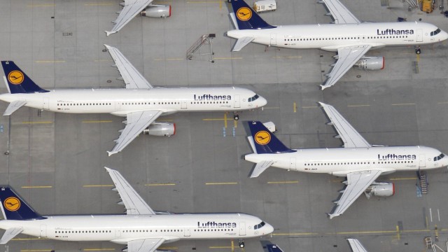 An aerial view shows Lufthansa planes parked on the tarmac of the closed Frankfurt's airport