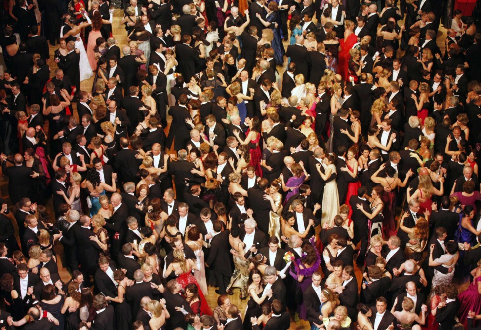 People dance inside the state opera during the traditional Opera Ball in Vienna