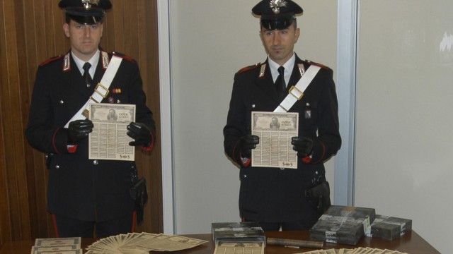 Italian Carabinieri display fake U.S. Treasury bonds during a news conference in the southern Italian city of Potenza