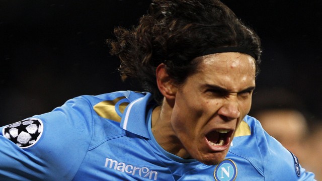 Napoli's Edinson Cavani celebrates after scoring against Chelsea during their Champions League last 16 first leg soccer match at the San Paolo stadium in Naples