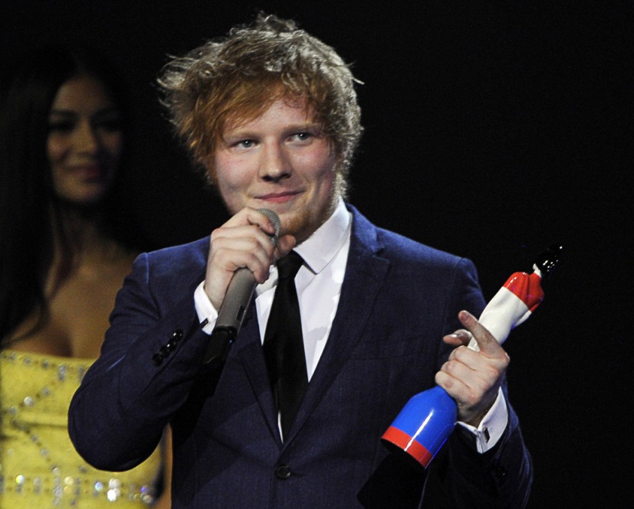 Ed Sheeran speaks as he holds his best British breakthrough award during the BRIT Music Awards at the O2 Arena in London