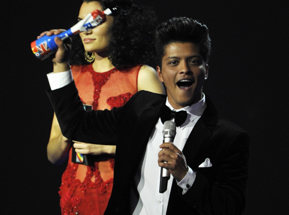 Bruno Mars holds his award for best international male solo artist during the BRIT Music Awards at the O2 Arena in London