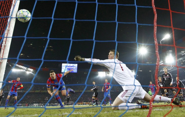 Bayern Munich's goalkeeper Neuer catches the ball as FC Basel's Xhaka tries to score during their Champions League last 16 first leg soccer match in Basel