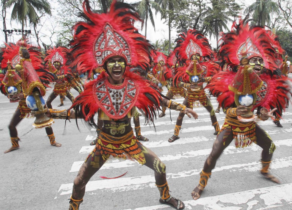 Students in colorful attires perform during a 'Pasinaya' festival in Manila