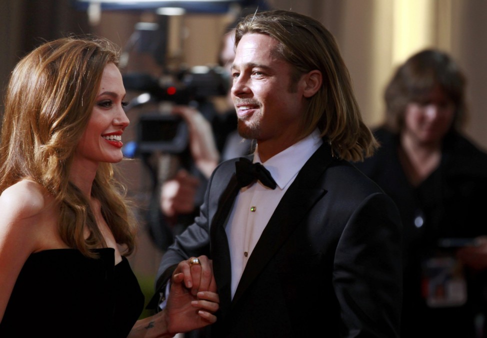 Actress and presenter Angelina Jolie and her partner actor Brad Pitt arrive at the 84th Academy Awards in Hollywood