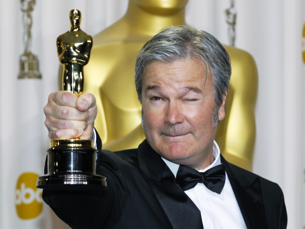 Director Gore Verbinski holds the Oscar for best animated feature film for his work in 'Rango' backstage at the 84th Academy Awards in Hollywood, California