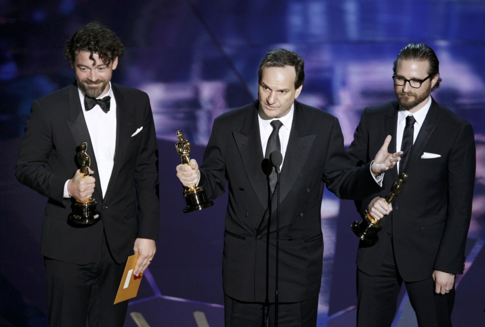 Legato, Henning, and Grossmann accept the Oscar for Best Visual Effects for their work in the film 'Hugo' at the 84th Academy Awards in Hollywood