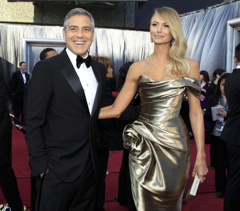 Actor George Clooney and girlfriend Stacy Keibler pose on the red carpet as they arrive at the 84th Academy Awards in Hollywood