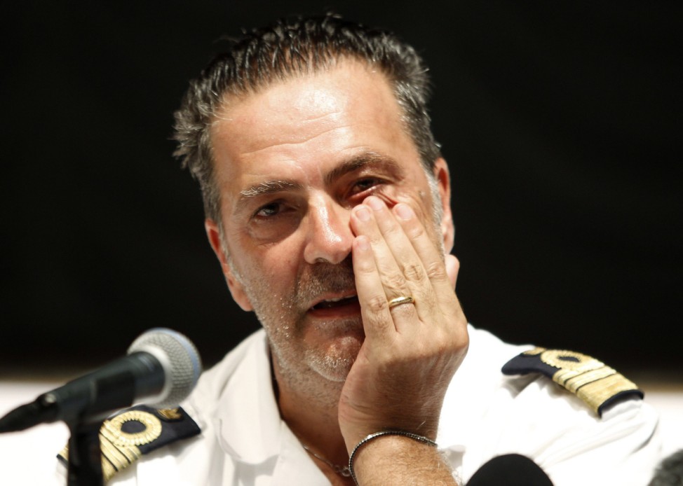 Captain Niccolo Alba of the Costa Allegra cruise ship wipes his tears during a news conference in Seychelles