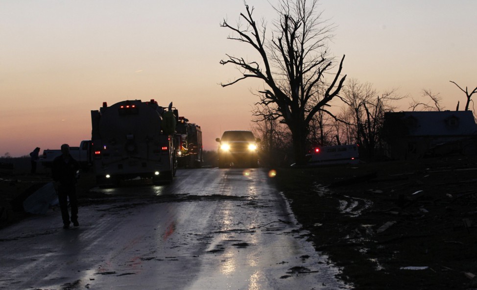 Residents work to clear storm damage after three tornados moved through the area in Chelsea, Indiana