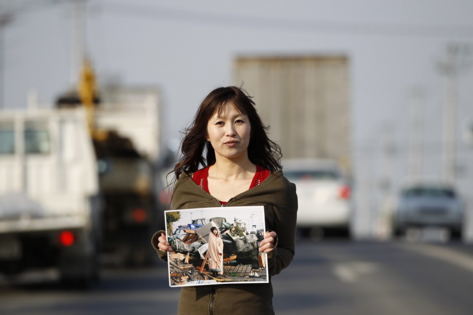 Yuko Sugimoto stands on a road in Ishinomaki