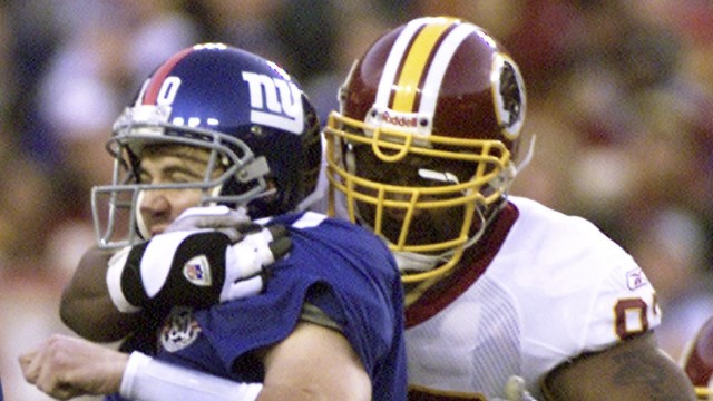 File photo of Washington Redskins Phillip Daniels sacking Giants Eli Manning in the their NFL game at FedEx Field in Landover