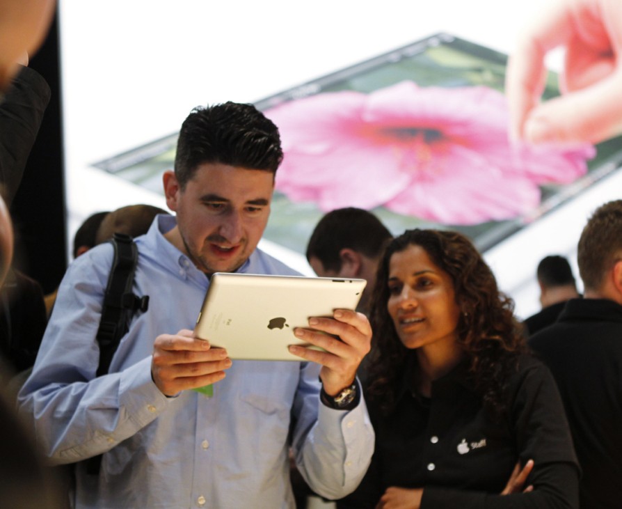 A man from the media takes a look at the new iPad in the demo area during an Apple event in San Francisco, California