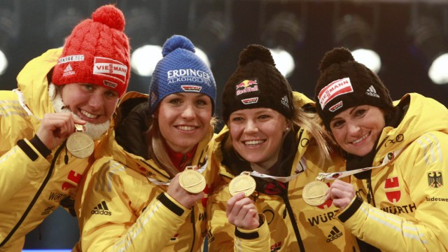 Germany's Bachmann, Neuner, Goessner and Henkel pose during the medal ceremony for the women 4 x 6.0 km relay race at the Biathlon World Championships in Ruhpolding