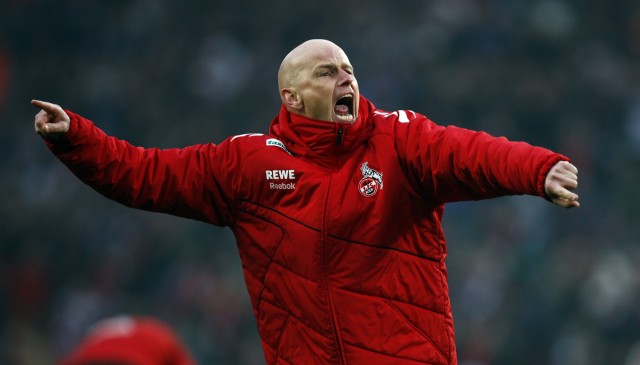 Cologne's coach Solbakken celebrates victory after their German Bundesliga soccer match against Berlin in Cologne