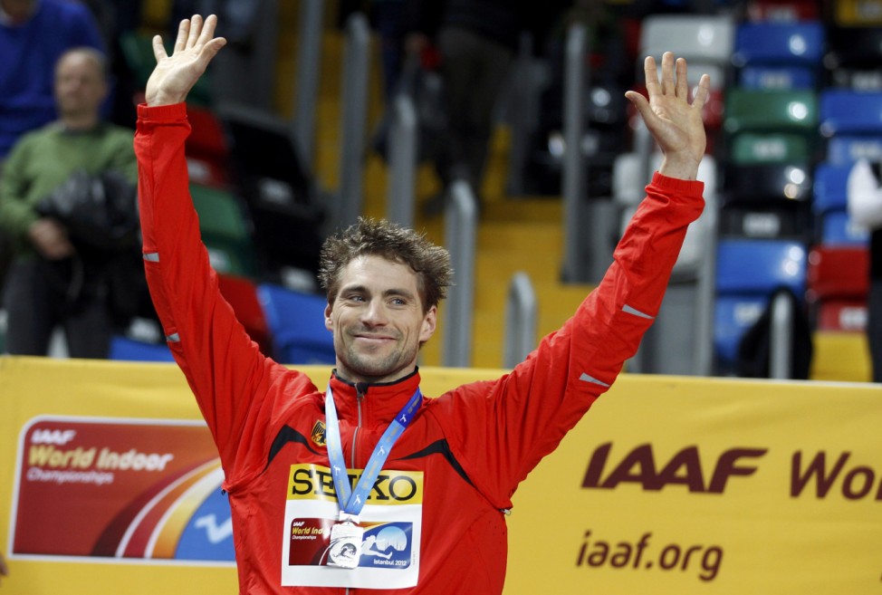 Otto of Germany celebrates his silver medal during the awards ceremony for the pole vault at the world indoor athletics championships in Istanbul