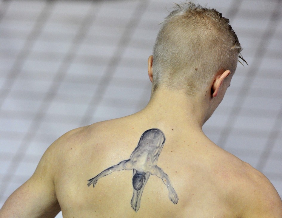 Tolvers of Sweden displays a diving tattoo as he prepares to compete during the Men's 3m Springboard Diveoff at the FINA Diving World Cup at the Olympic Aquatics Centre in London