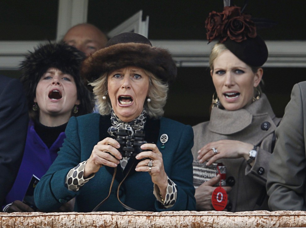 Britain's Camilla, Duchess of Cornwall, and Phillips react during The Queen Mother Champion Chase at the Cheltenham Festival horse racing meet in Gloucestershire