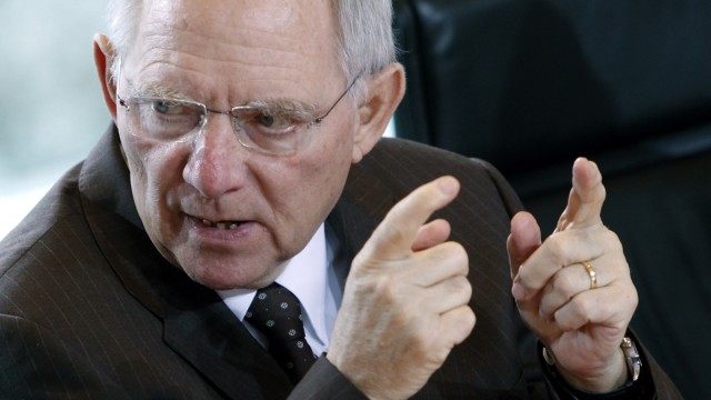 German Finance Minister Schaeuble gestures at the weekly cabinet meeting in Berlin