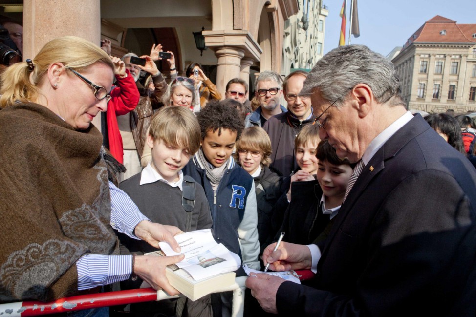 Presidential candidate Gauck signs autographs after church service at the French Cathedral in Berlin