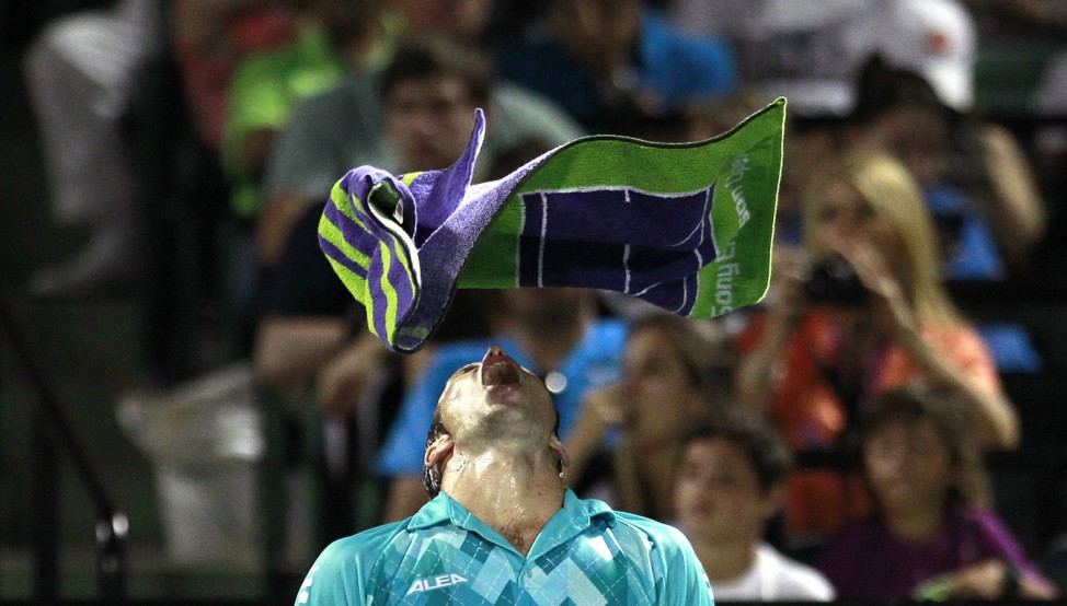 Stepanek of the Czech Republic throws his towel over his head during an end change after losing a challenge to Nadal of Spain during their men's singles match at the Sony Ericsson Open tennis tournament in Key Biscayne