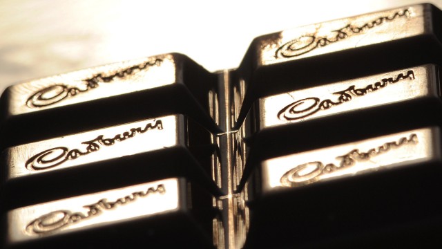 The Cadburys logo is seen on a bar of chocolate