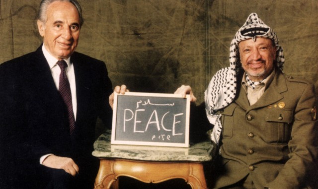 A file picture shows Palestinian President Yasser Arafat and former Israeli Foreign Miniter Shimon Peres