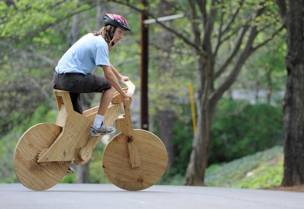 Boy makes wooden bicycle
