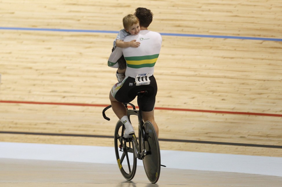 Team Australia Perkins celebrates with son Aidan after winning Men's Team Sprint Final at 2012 UCI Track Cycling World Championships in Melbourne