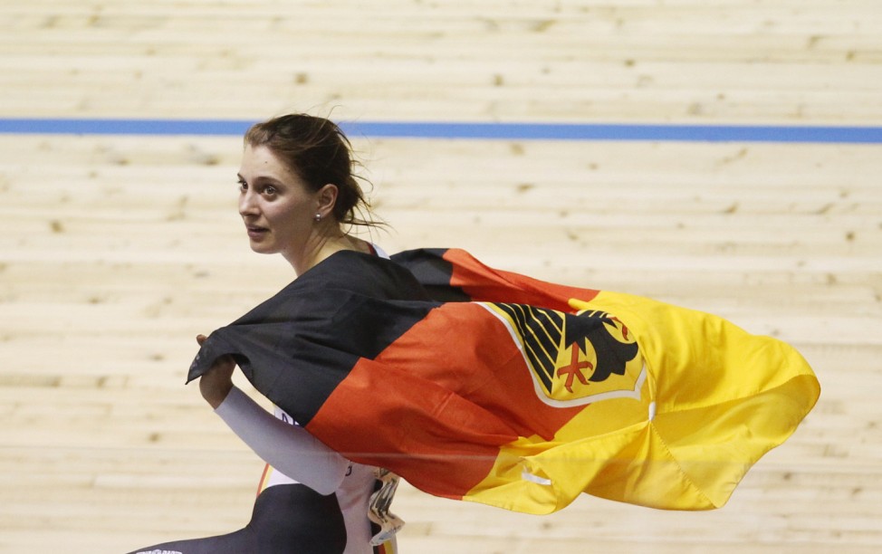 Team Germany's Welte celebrates winning gold at Women's Team Sprint Final at 2012 UCI Track Cycling World Championships in Melbourne