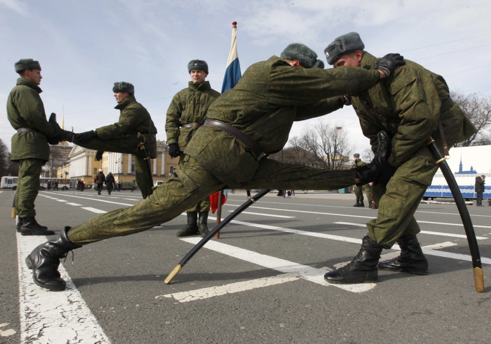 Russian soldiers limber up before practising their marching technique for victory day parade on the Palace square in St. Petersburg