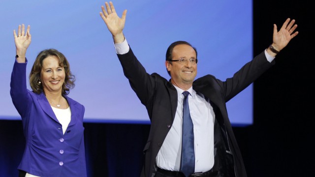Hollande, Socialist Party candidate for the 2012 French presidential election, arrives with Segolene Royal in Rennes