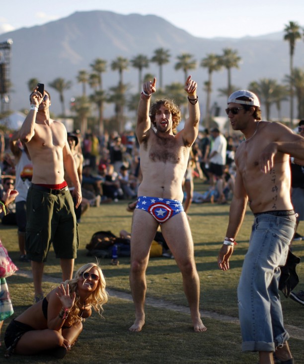 People dance at the 2012 Coachella Valley Music and Arts Festival in Indio, California.