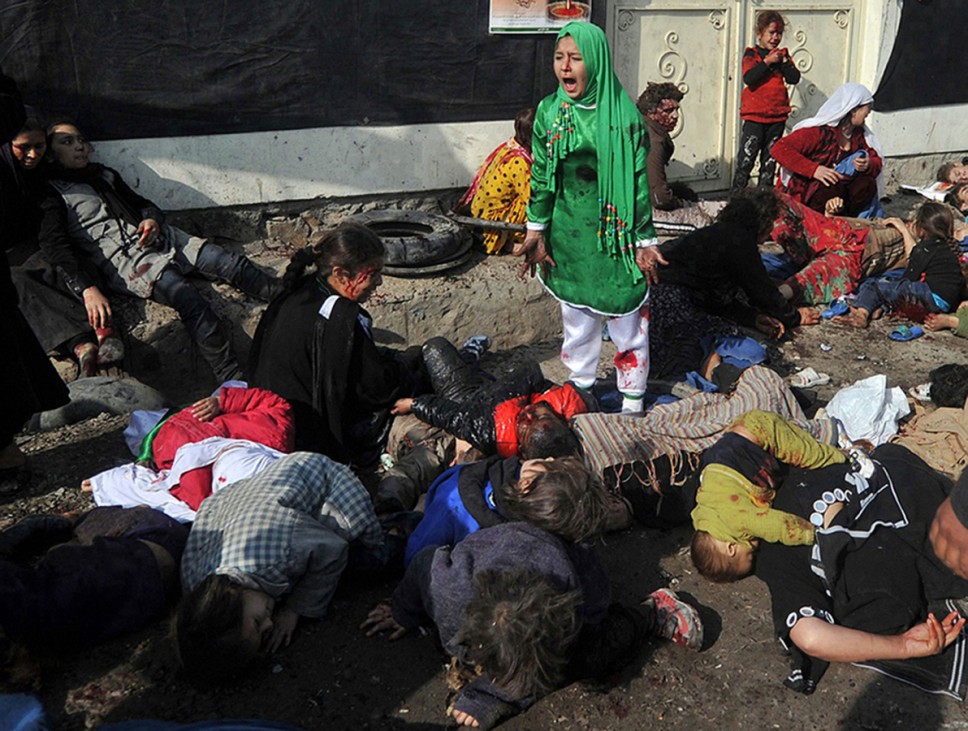 Tarana Akbari, 12, screams in fear moments after a suicide bomber detonated a bomb in a crowd at the Abul Fazel Shrine in Kabul in this handout photo