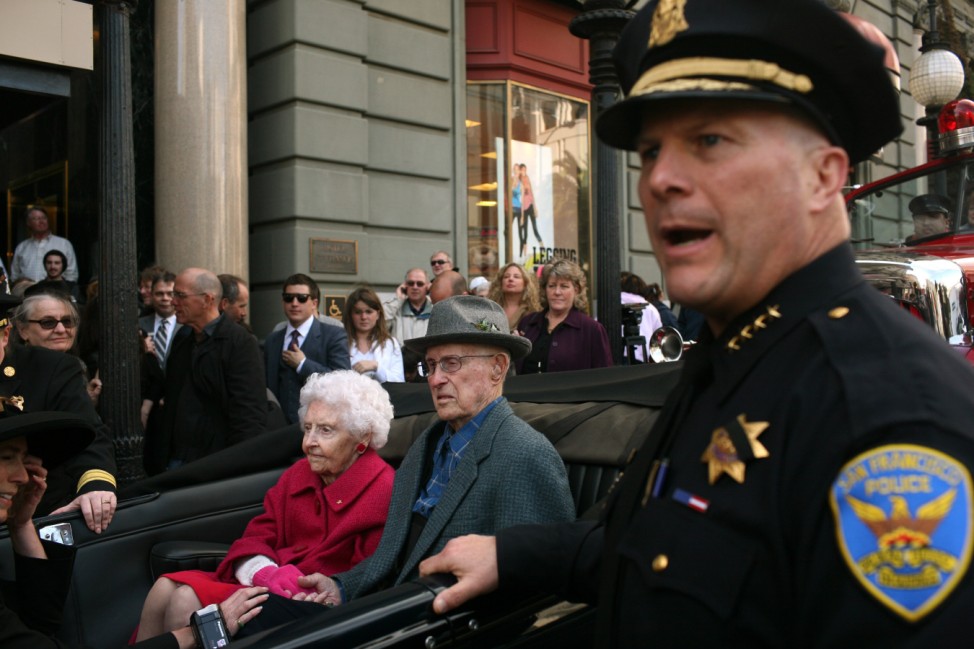 San Francisco Police Chief Greg Suhr escorts Hook and Quilici, two of the four known survivors of San Francisco's great earthquake and fire of 1906, to John's Grill for the city's annual survivors dinner in San Francisco