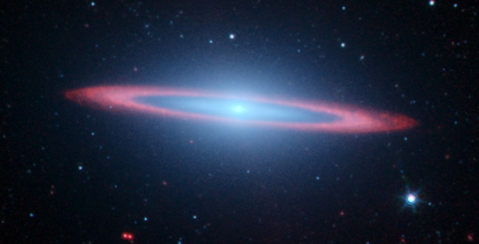 NASA's Spitzer and Hubble Space Telescopes joined forces to create this striking composite image of one of the most popular sights in the universe. Messier 104 is commonly known as the Sombrero galaxy because in visible light, it resembles the broad-brimm