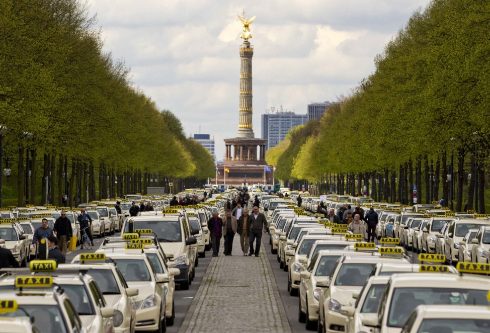 Taxis line the Strasse des 17. Juni thoroughfare in central Berlin during a strike by taxi drivers against news tariffs for journeys to and from Berlin's new airport