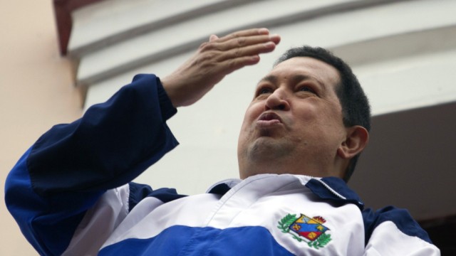 Venezuelan President Hugo Chavez blow a kiss from 'people's balcony' at Miraflores Palace in Caracas