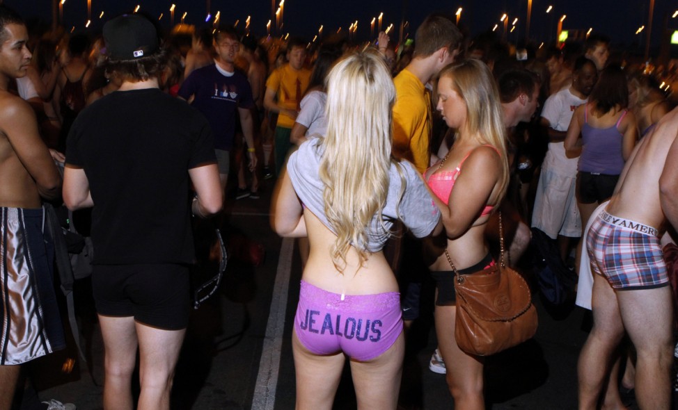 Arizona State University students mingle as they celebrate last day of classes by taking off their clothes and donating them to charity during ASU Undie Run in Tempe
