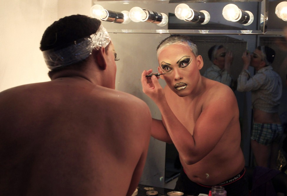 A participant gets ready to take part in 'Miss Gay Nicaragua 2012' in Managua