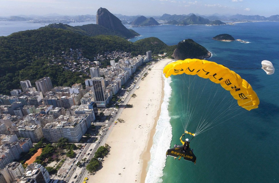 Yves Rossy, known as the Jetman, prepares to land during a successful flight over Rio de Janiero