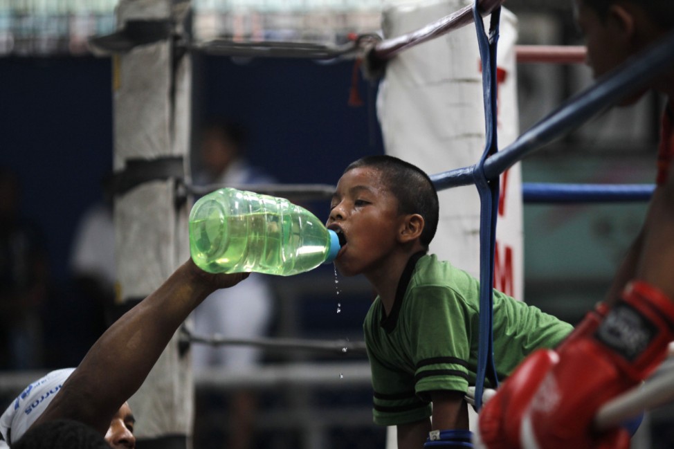 Ulises, 8, drinks water during a training session at the Rockero Alcazar gym in the low-income neighbourhood of Curundu in Panama City