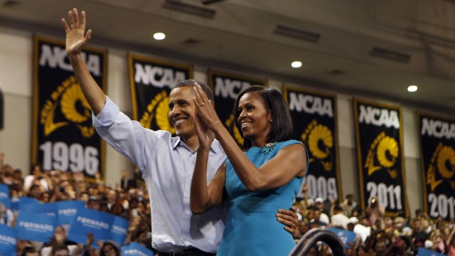 U.S. President Obama and First Lady Michelle wave to supporters during a campaign rally at Virginia Commonwealth University in Richmond, Virginia