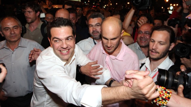 Head of Greece's Left Coalition party Alexis Tsipras celebrates with supporters in Athens