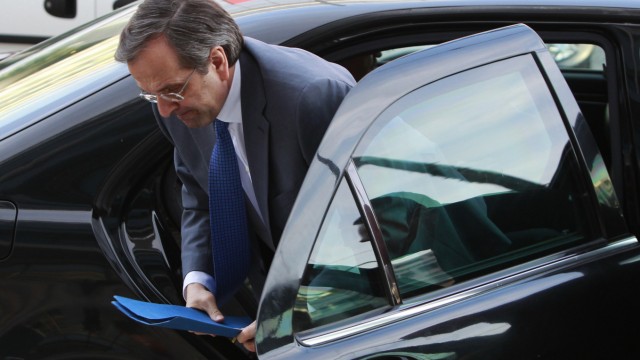 Greek conservative party leader Samaras arrives at the headquarters of his party in Athens